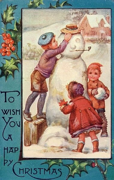 Three children completing their snowman