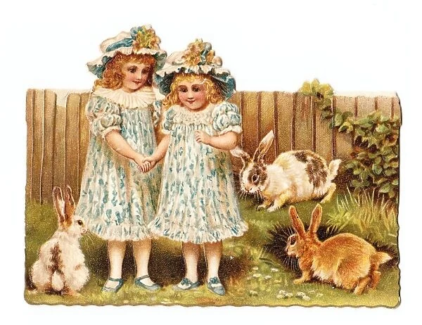 Two girls in a garden on a cutout greetings card