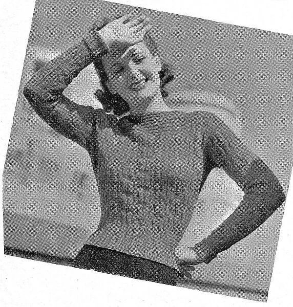 Model wearing tight knitted sweater in fancy rib stitch. Date: 1940