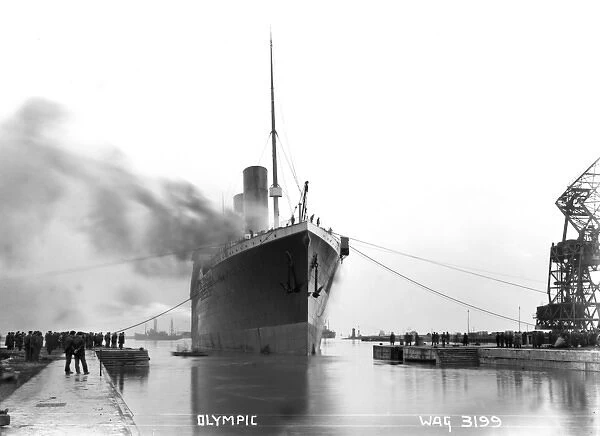 Olympic - a front view of the ship coming in the dock with a lot of people