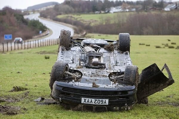A BMW car crashed on its roof in the middle of a field after leaving the road at high speed on the A66 near Keswick Cumbria