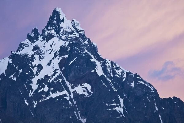 Sunset on snow-capped mountain peaks that are a part of the Andes Mountains just outside Ushuaia, Argentina