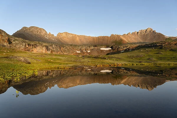 USA, Colorado, Uncompahgre National Forest. Three Needles mountains reflect in mountain pond