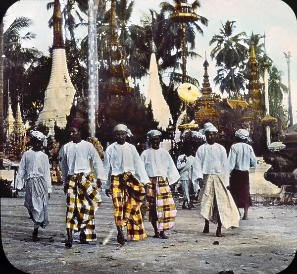 BURMA: STREET SCENE, c1895. A group of five men walking along the street, in native dress