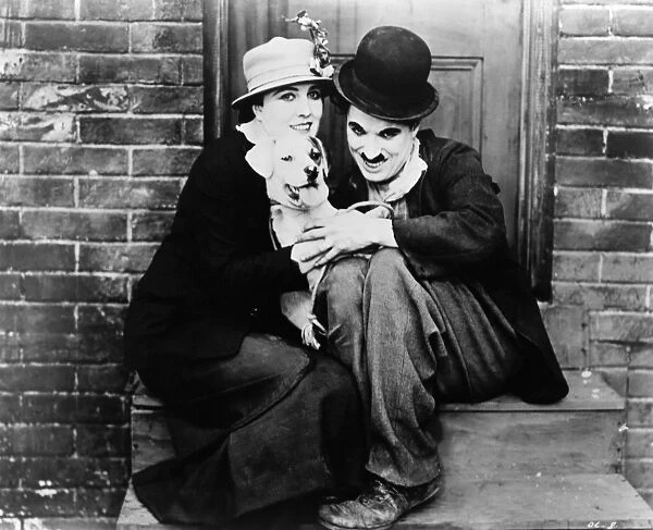 CHAPLIN: A DOGs LIFE, 1918. Charlie Chaplin and Edna Purviance in the film A Dogs Life