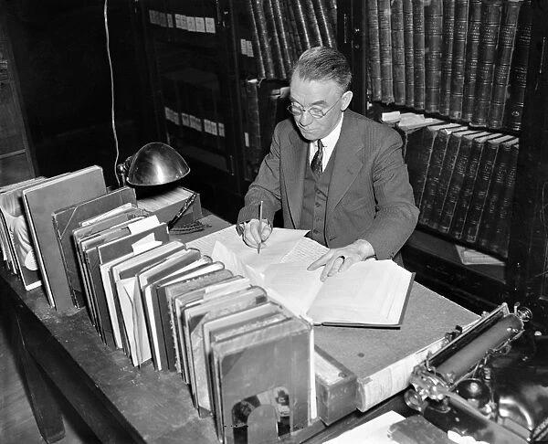 JOHN CLEMENT FITZPATRICK (1876-1940). American writer and historian, editing and compiling the writings of George Washington at the Library of Congress in Washington, D. C. Photograph, 1937