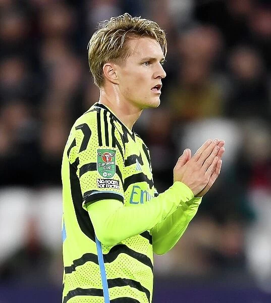 Arsenal's Martin Odegaard Applauding Fans after Carabao Cup Victory over West Ham United