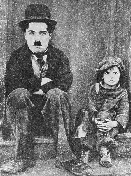 Charlie Chaplin and Jackie Coogan in The Kid