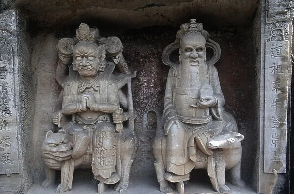 China, Chongqing, Dazu County, stone sculptures of Bodhisattva Manjushri riding lion and Samantabhadra riding elephant