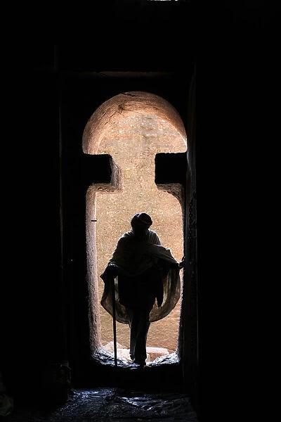 Man entering Bet Medhane Alem church in Lalibela