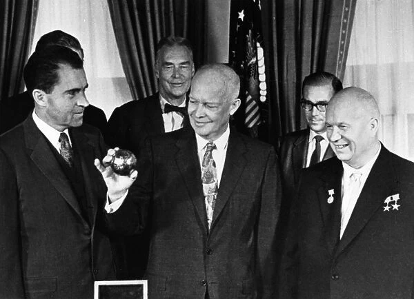 Nikita khrushchev with president dwight d, eisenhower and vice-president richard m, nixon at the whitehouse on september 16, 1959, khrushchev just presented the president with a copy of the pendant that was deposited on the moon by a soviet space rocket (luna 2)