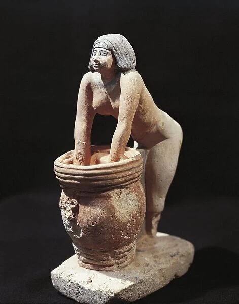 Painted limestone statuette of woman making beer, from Giza, Egypt