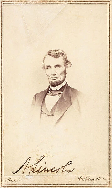 Abraham Lincoln, signed carte-de-visite, 1864 (vignette, mount, gold-ruled border, ink)