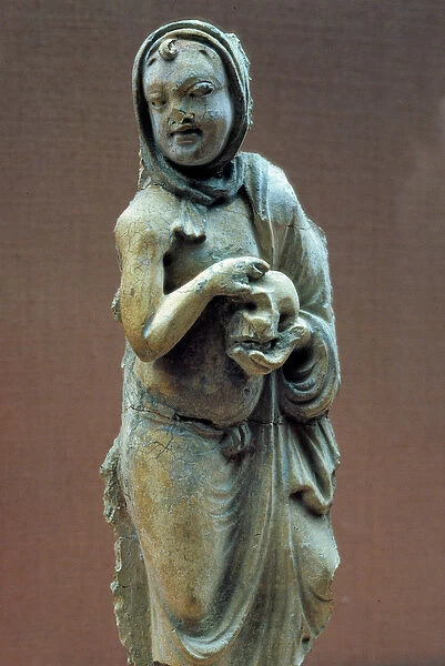 Art of Gandhara (or Greco-Buddhism): demon has a childs head holding a skull