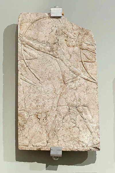 Assyrian archers shooting arrows, Neo Assyrian Empire, reign of Ashurnasirpal II (limestone with traces of painting)