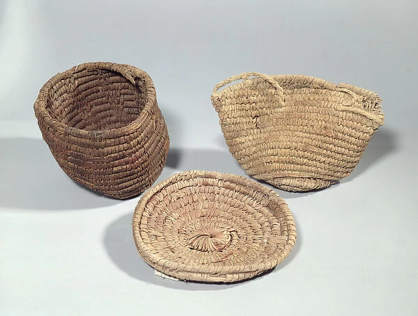 Two baskets and a cover (woven palm fronds)