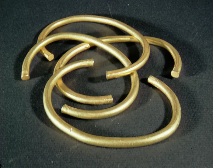 Framed Print : Bracelets, with decorated tips, to be worn together (bronze) Framed Print : Bracelets, with decorated tips, to be worn together (bronze)
