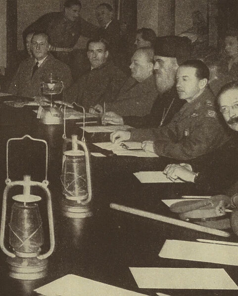 British Prime Minister Winston Churchill in Athens to discuss the political crisis in Greece, attending a meeting by the light of hurricane lamps due to power cuts caused by a general strike, World War II, December 1944 (b  /  w photo)