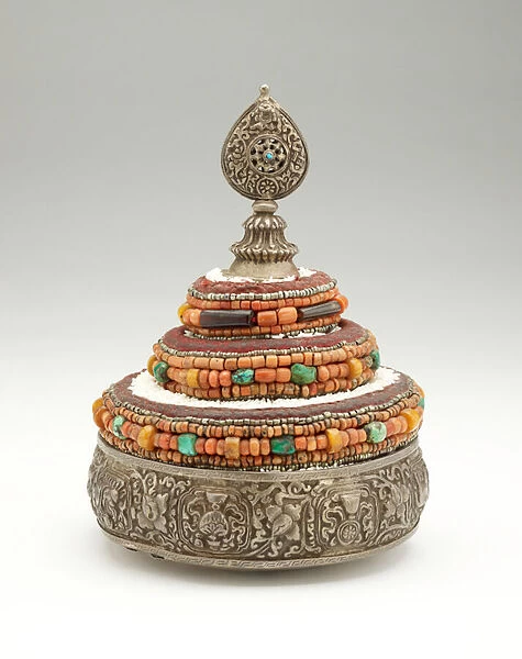 Buddhist cosmos mandala offering, late 19th-early 20th century (silver repousse with coral, turquoise, lapis lazuli, and silver beads)