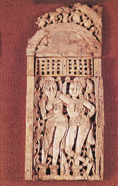 Carved Indian plaque depicting two female figures under a torana, from Begram, Afghanistan