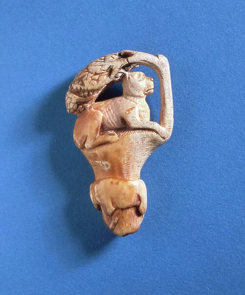 Carved knife handle in the form of a cat in a tree and a wolf or dog in relief around the trunk, Smyrna (ivory)