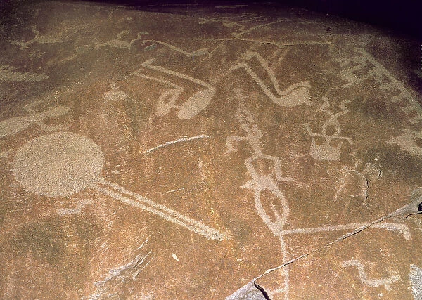 Carved petroglyph depicting figures, deer, elk, birds, boats and circles, 3rd millennium BC
