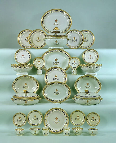 Ch'ien Lung porcelain famille rose armorial dinner service, painted with a central coat of arms, helmet, mural crown and crest with a band of gilt spearheads, c.1748