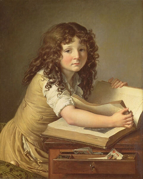 A child looking at pictures in a book