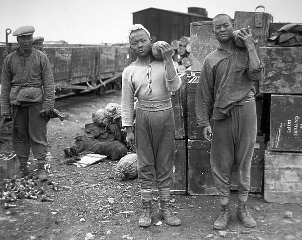 Chinese carrying shells at an ammunition depot in France, 1917 (b  /  w photo)