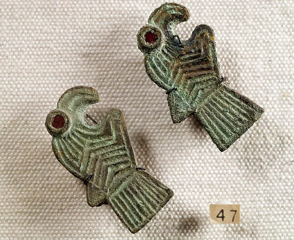 Christian antiquite: bronze fibules inlaid with garnet in the shape of eagle heads