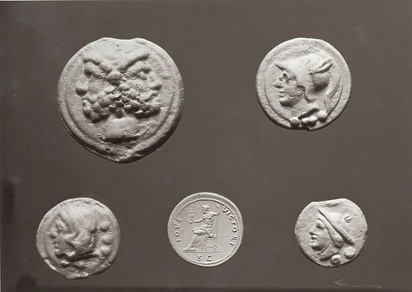 Five coins depicting Janus, Jupiter, Mercury and Minerva