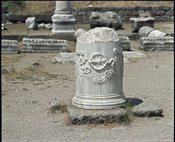 Column decorated with the symbol of the god Asclepios. Sanctuary of Asclepios