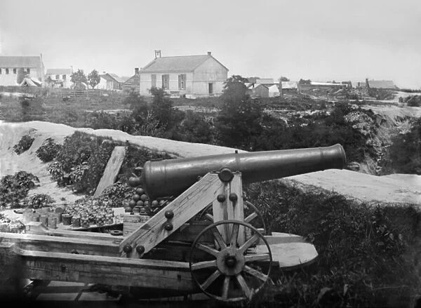 Confederate 32-pounder gun captured outside Yorktown, Virginia, c. July 1862 (b  /  w photo)