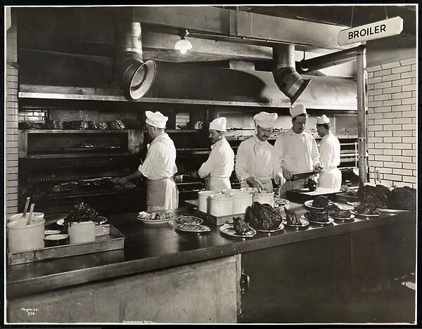 Cooks at the broiler in the kitchen of the Hotel Commodore, 1919 (silver gelatin print)