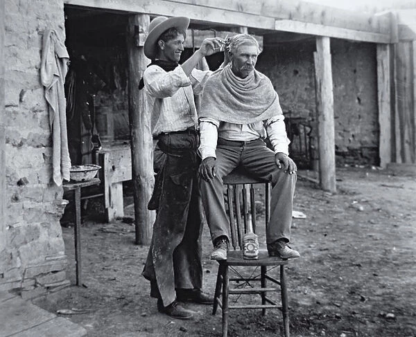 Cowboy having haircut, c. 1905 (b  /  w photo)