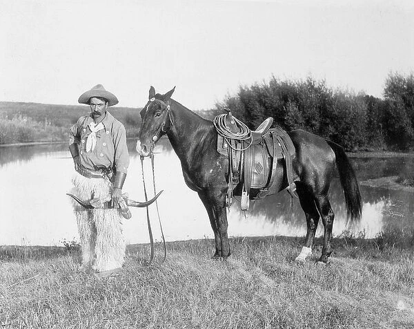 Cowboy and horse, Nebraska, 1888 - photograph by Solomon D. Butcher