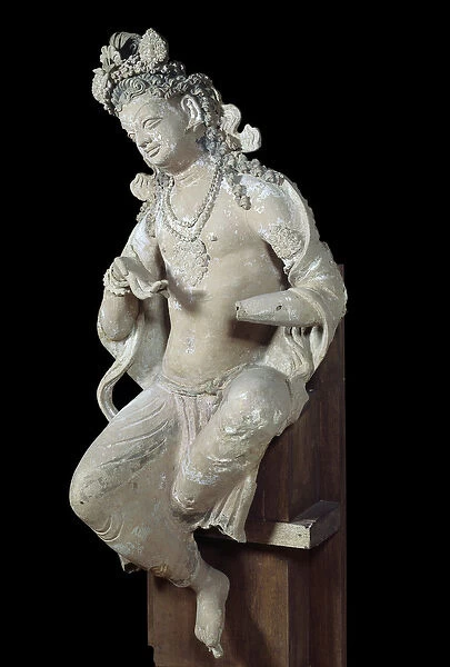 Devata (female divinite) sitting. Sculpture in dry stone. 7th century