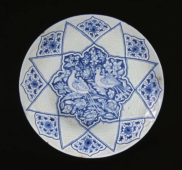 Dish, Iran, Safavid period, early 18th century (stone-paste with incised decoration and blue under glaze)
