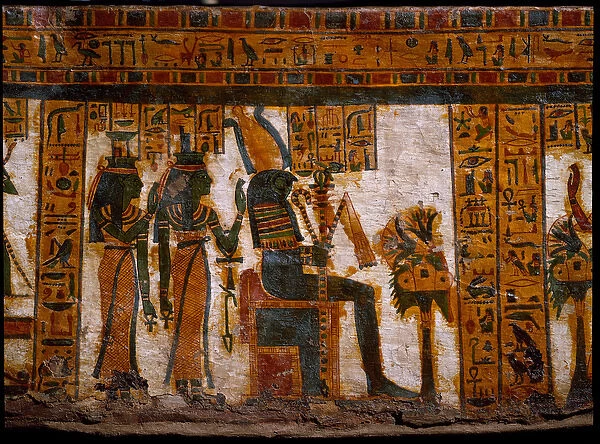 The divinites Isis and Nephtys worshipping Osiris. 1085-935 BC (painted wood)