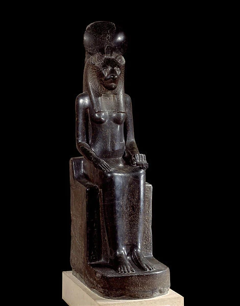 Egyptian antiquite: black granite statue of the deity with the head of a lioness Sekhmet