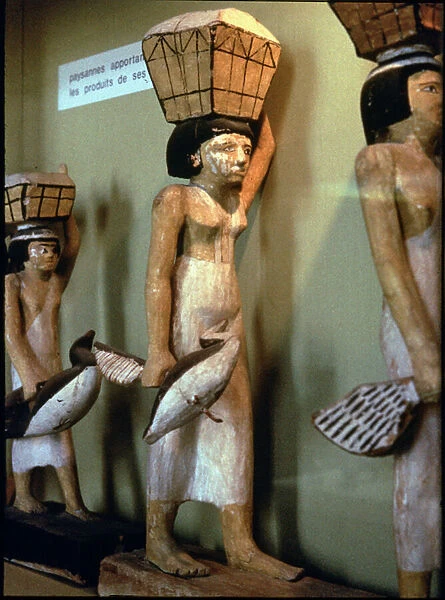 Female bearers bringing offerings for the deceased, from the cemetery at Assiut, Middle Kingdom, c. 2060-1786 BC (plaster and figwood)
