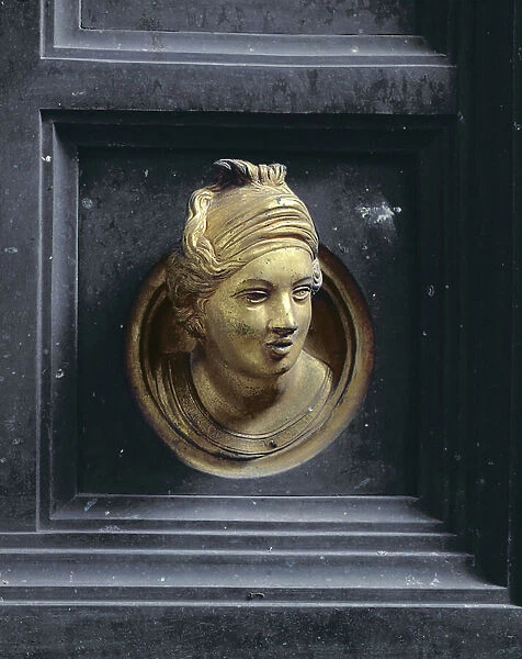 Female head, roundel from the frame of the Gates of Paradise (East doors) by Lorenzo Ghiberti (1378-1455) 1425-52 (gilt bronze) (see also 87652-62 & 87664-67)