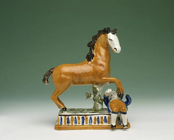 Figurine of a horse trampling a man, from Staffordshire (ceramic)