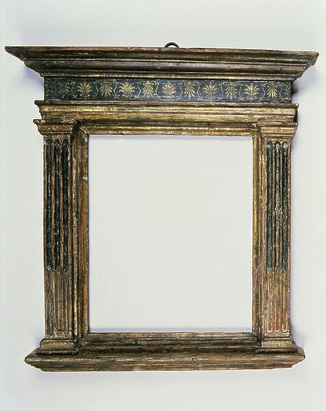 Florentine 15th century carved, gilt and polychrome tabernacle, the unworked canopy cornice above a frieze with painted anthemion decoration, the entablature supported on stop fluted pilasters headed by plain capitals and moulded base, c.1460-80
