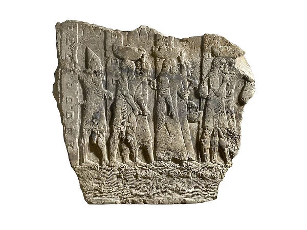 Fragment of Assyrian relief showing soldiers escorting loot and captives from Babylon
