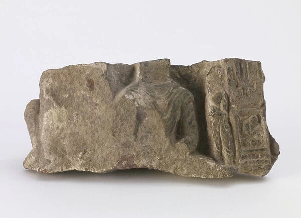 Fragment, showing torso of seated Buddha, a standing Bodhisattva