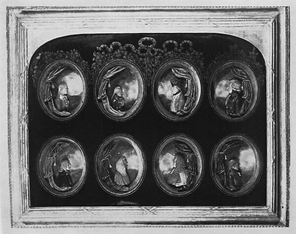 Frame containing eight portraits (wax)