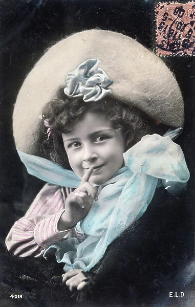 French postcard dated circa, 1900, showing a young girl gesturing silence