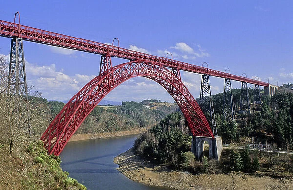 The Garabit viaduct (rail bridge) in the Cantal in Auvergne (France) crosses the waters of the dam's reservoir lake. Architecture by Gustave Eiffel, 1881-1884