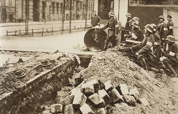 Government troops who had seized a Spartacist trench in the Frankfurter Allee, Berlin